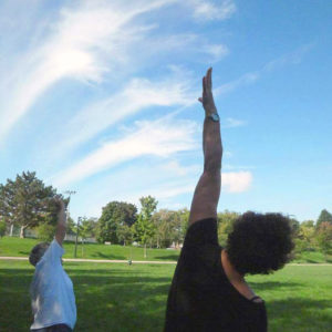 Outdoor yoga, reaching to the sky