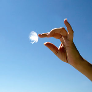 Hand in Mudra against blue sky