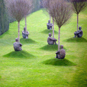 statues hugging trees