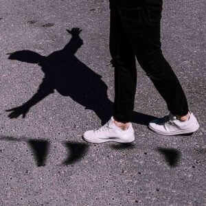 balancing on a shadow line photo by Raphael Renter